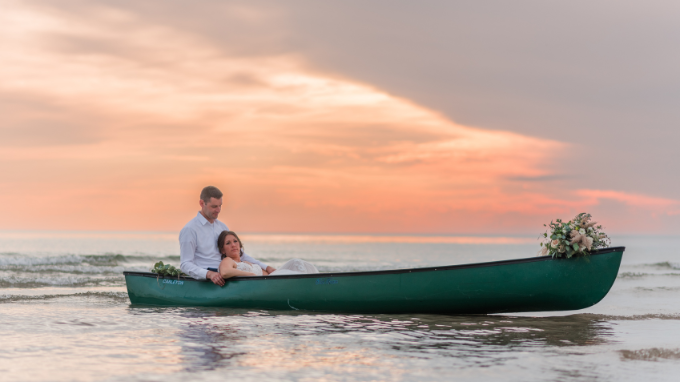 Bride and groom in canoe
