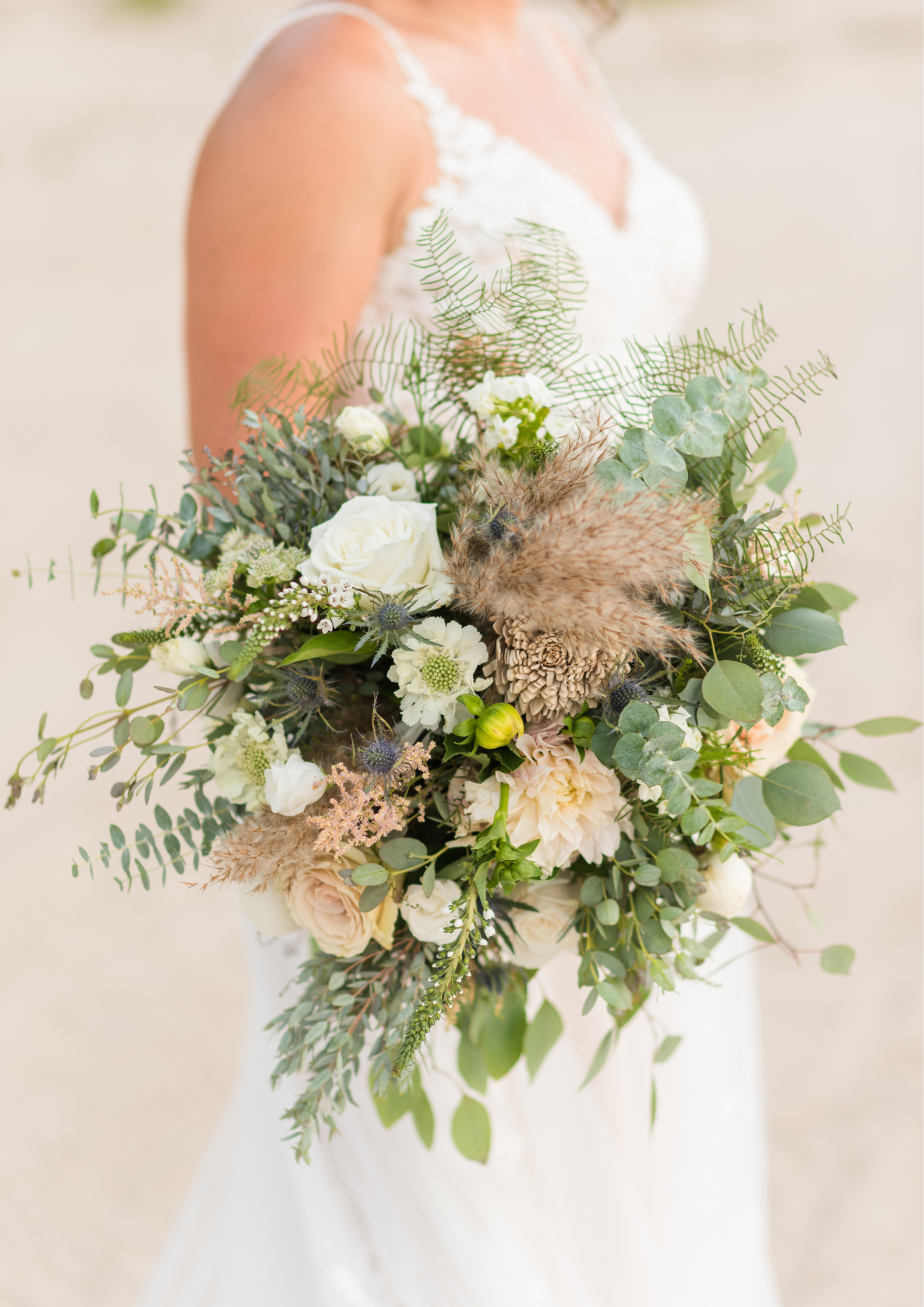 Bride holding bouquet of white flowers